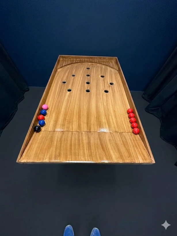 Wooden game table with playing pucks
